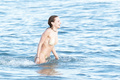 Francesca Eastwood topless in Malibu beach
