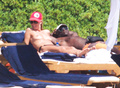 Heidi Klum sunbathing topless in Sardinia (8/2011)