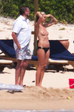 Heidi Klum sunbathing topless in Sardinia (8/2011)