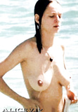 Uma Thurman - topless on the beach in St. Bart's (7/96)