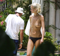 Claudia Schiffer - topless sunbathing (2002)