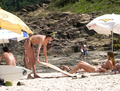 Charlize Theron - sunbathing topless in Brazil (1/2005)