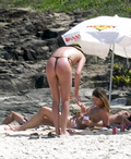 Charlize Theron - sunbathing topless in Brazil (1/2005)