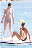 Geena Davis - topless sunbathing (1999)