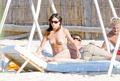 Claire Forlani - sunbath topless in St. Tropez (7/2004)