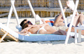 Claire Forlani - sunbath topless in St. Tropez (7/2004)