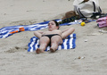 Kelly Brook sunbathing topless in St. Bart’s (1/2008)