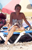 Sienna Miller - sunbathing topless in Ibiza (8/2007)