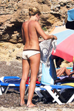 Sienna Miller - sunbathing topless in Ibiza (8/2007)