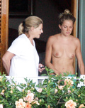 Sienna Miller - topless on balcony (7/2008)