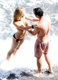 Sienna Miller - topless on the beach in Italy (7/2008)