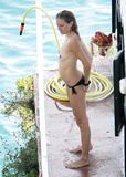 Sienna Miller - topless on the beach in Italy (7/2008)