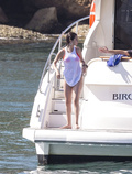 Selena Gomez wearing a bikini on a boat