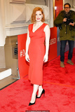 Redhead Jessica Chastain in red dress at red carpet
