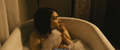 Daniella Pineda in a bathtub scenes from Mercy Black (2019)