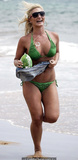 Brooke Hogan in green bikini on a beach
