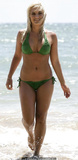 Brooke Hogan in green bikini on a beach